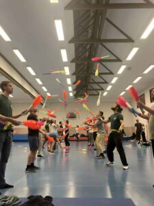 Jugglers practice with clubs at PassOut Goirle 2025-2026, a juggling convention. - Passing Zone
