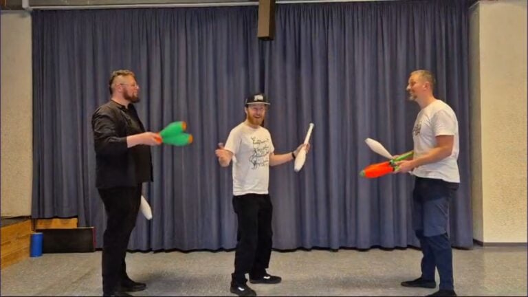 Three men juggling clubs; a scene related to "Mini Chopabout No. 2 - Priscilla. - Passing Zone