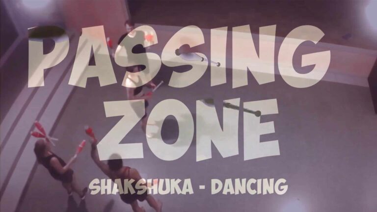 Juggling clubs in "Passing Zone: Shakshuka - Dancing" performance. - Passing Zone