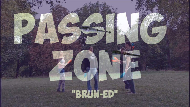 Passing Zone: Four people passing juggling clubs in a grassy field. "Brun-Ed" text overlay. - Passing Zone